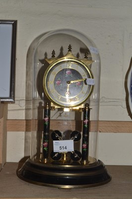 Lot 514 - Floral decorated anniversary clock under glass...