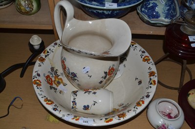 Lot 545 - Floral decorated wash bowl and jug