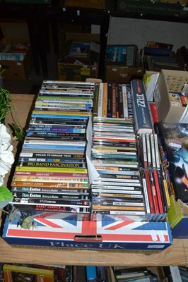 Lot 593 - One box of assorted CDs, DVDs and a book of...