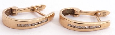 Lot 233 - Pair of 10k stamped diamond set hoop earrings,...