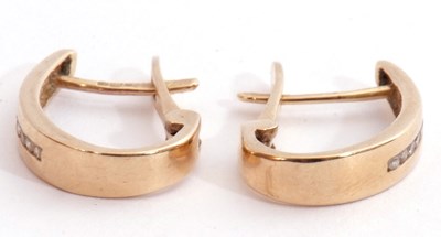 Lot 233 - Pair of 10k stamped diamond set hoop earrings,...