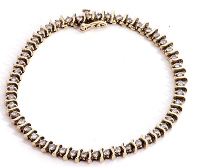 Lot 253 - Diamond line bracelet featuring 49 small...