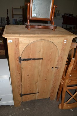 Lot 894 - A pine cupboard with arched door