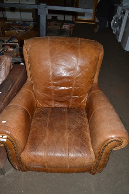 Lot 904 - Brown leather high back armchair