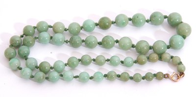 Lot 275 - Single row of graduated pale green jade beads,...