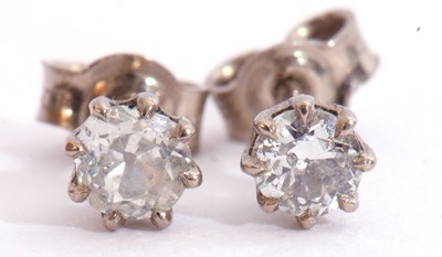 Lot 277 - Small pair of diamond stud earrings, the round...