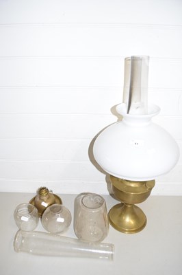 Lot 61 - Brass based oil lamp together with a further...