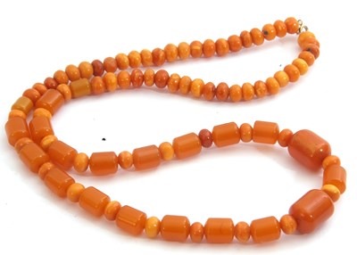 Lot 305 - Amber bead necklace, a single row of...