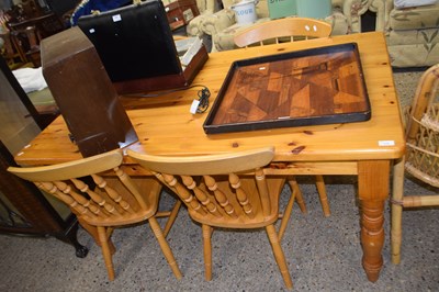 Lot 270 - Modern pine kitchen table and four chairs,...