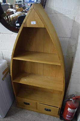 Lot 328 - Modern light oak boat shaped bookcase cabinet...