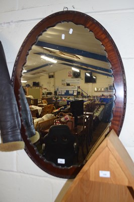 Lot 329 - Dark wood framed oval wall mirror