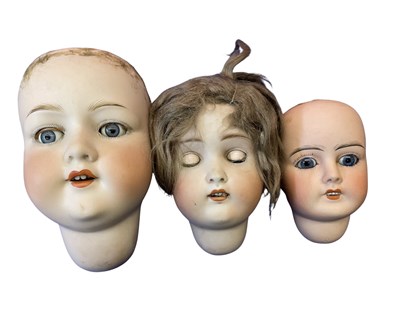 Lot 290 - Three bisque dolls heads. - Armand Marseille...