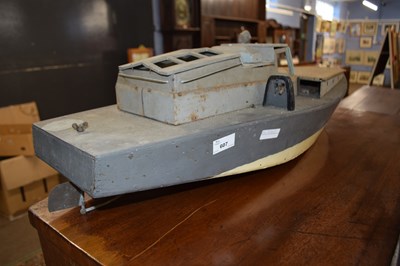 Lot 607 - Vintage wood and metal toy boat with engine,...