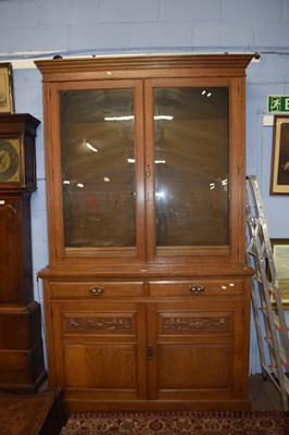 Lot 638 - Late Victorian light oak bookcase cabinet with...