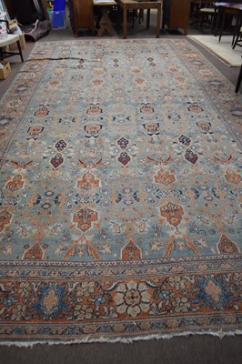 Lot 659 - Large caucasian faded wool carpet with...