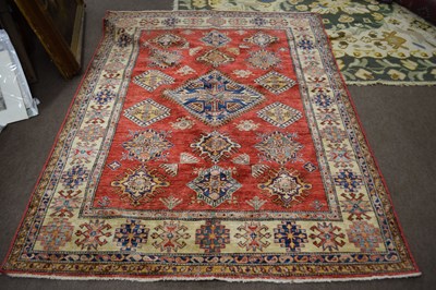 Lot 662 - 20th Century Pakistani wool rug decorated with...