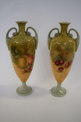 Lot 353 - Pair of porcelain vases painted with fruit in...