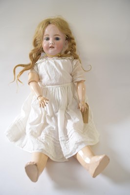 Lot 373 - German bisque headed doll in original clothing,...