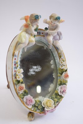 Lot 424 - Small porcelain dressing table mirror of oval...