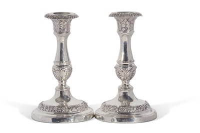 Lot 3 - A pair of George IV candlesticks with baluster...