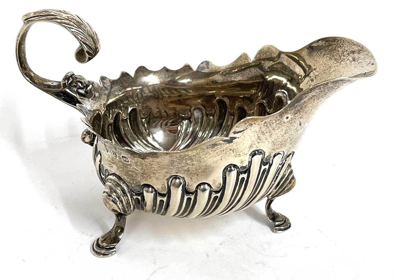 Lot 19 - Victorian silver cream jug having a part...