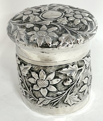 Lot 25 - Continental white metal jar and cover, heavily...