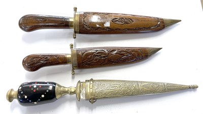 Lot 319 - A trio of ornately decorated/carved short...