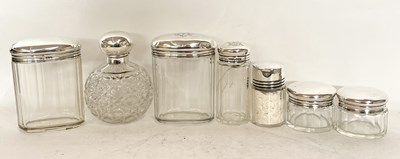 Lot 97 - Group of silver lidded dressing table jars and...