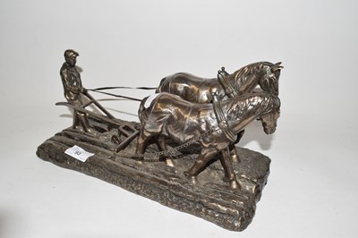 Lot 93 - Bronzed resin model of horses ploughing