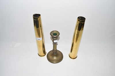 Lot 188 - Pair of brass shell cases and a brass candlestick
