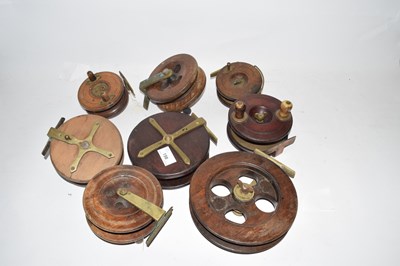 Lot 198 - A collection of eight wooden centre pin...