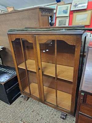Lot 360 - Oak veneered glazed two door bookcase cabinet