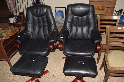 Lot 411 - Pair of black swivel armchairs and...