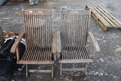 Lot 491 - Pair of wooden garden seats