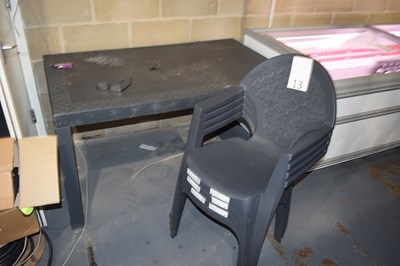 Lot 13 - Plastic garden table with four chairs, table...