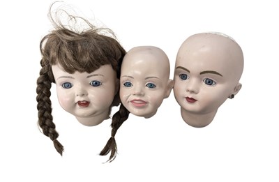 Lot 339 - A trio of composite doll heads, to include: -...