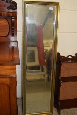 Lot 235 - Rectangular bevelled wall mirror in gilt...