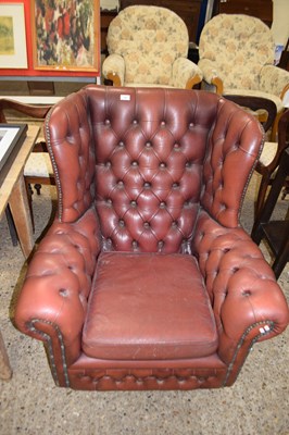 Lot 308 - Red buttoned leather Chesterfield style wing...