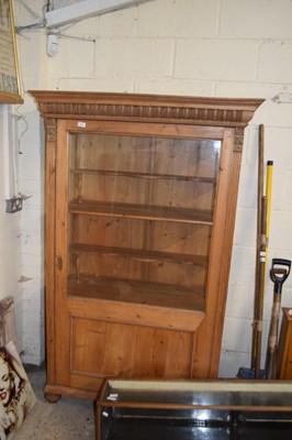 Lot 387 - Pine glazed side cabinet with single door and...