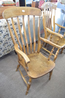 Lot 519 - Late 19th Century elm seated windsor chair...