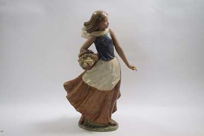 Lot 301 - Lladro figure of a flower seller raised on an...