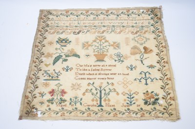 Lot 331 - A small sampler with typical embroidery and...