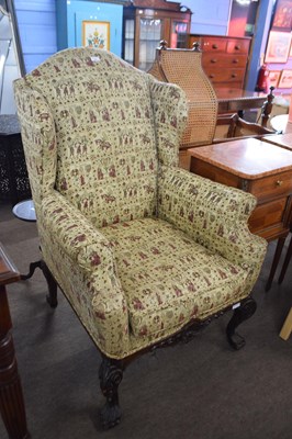 Lot 564 - Georgian style wing back armchair upholstered...