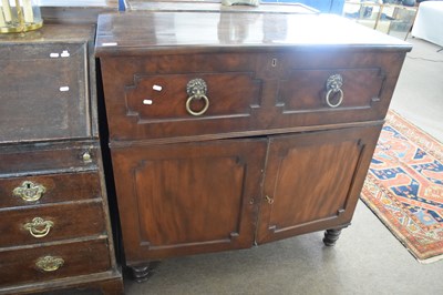 Lot 573 - A Georgian mahogany secretaire cabinet with...