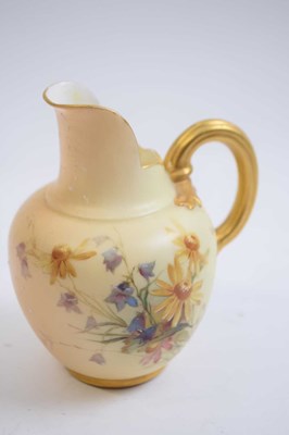 Lot 384 - Small blush ground ewer painted with flowers...