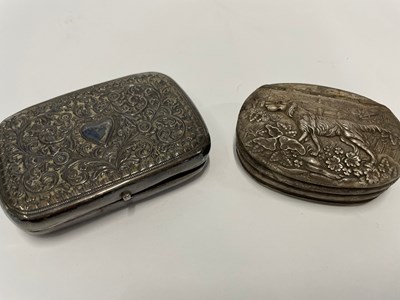 Lot 410 - Small plastic box containing an oval metal...