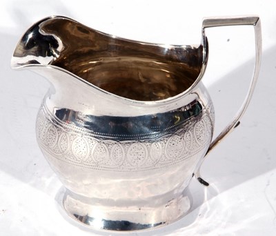 Lot 12 - George III silver cream or milk jug, helmet...