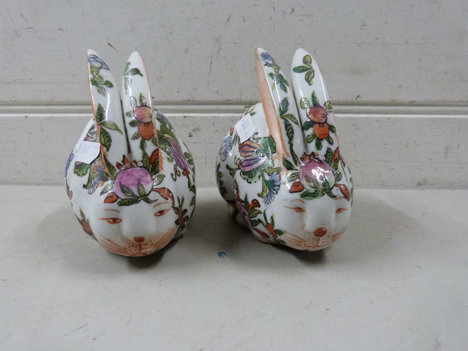 Lot 52 - A pair of Chinese pottery rabbits