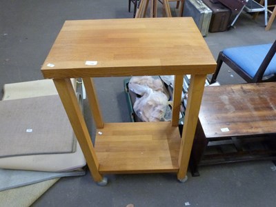 Lot 796 - Modern light oak two tier table on wheels