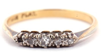 Lot 13 - Four stone diamond ring featuring four small...